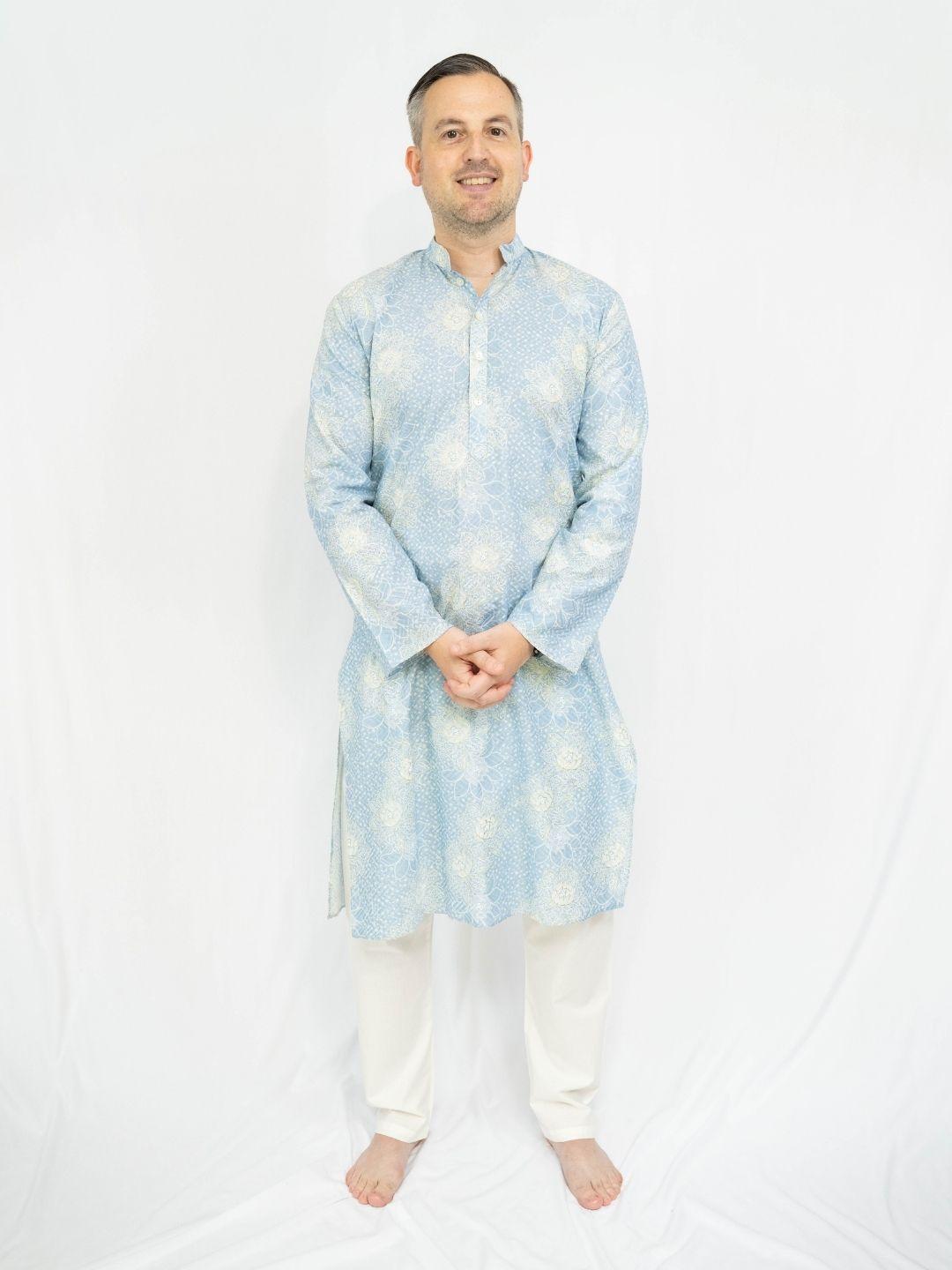 Men’s pale blue ethnic kurta pajama with subtle all-over pattern and white trousers, styled in a breathable cotton look. - Nimbu