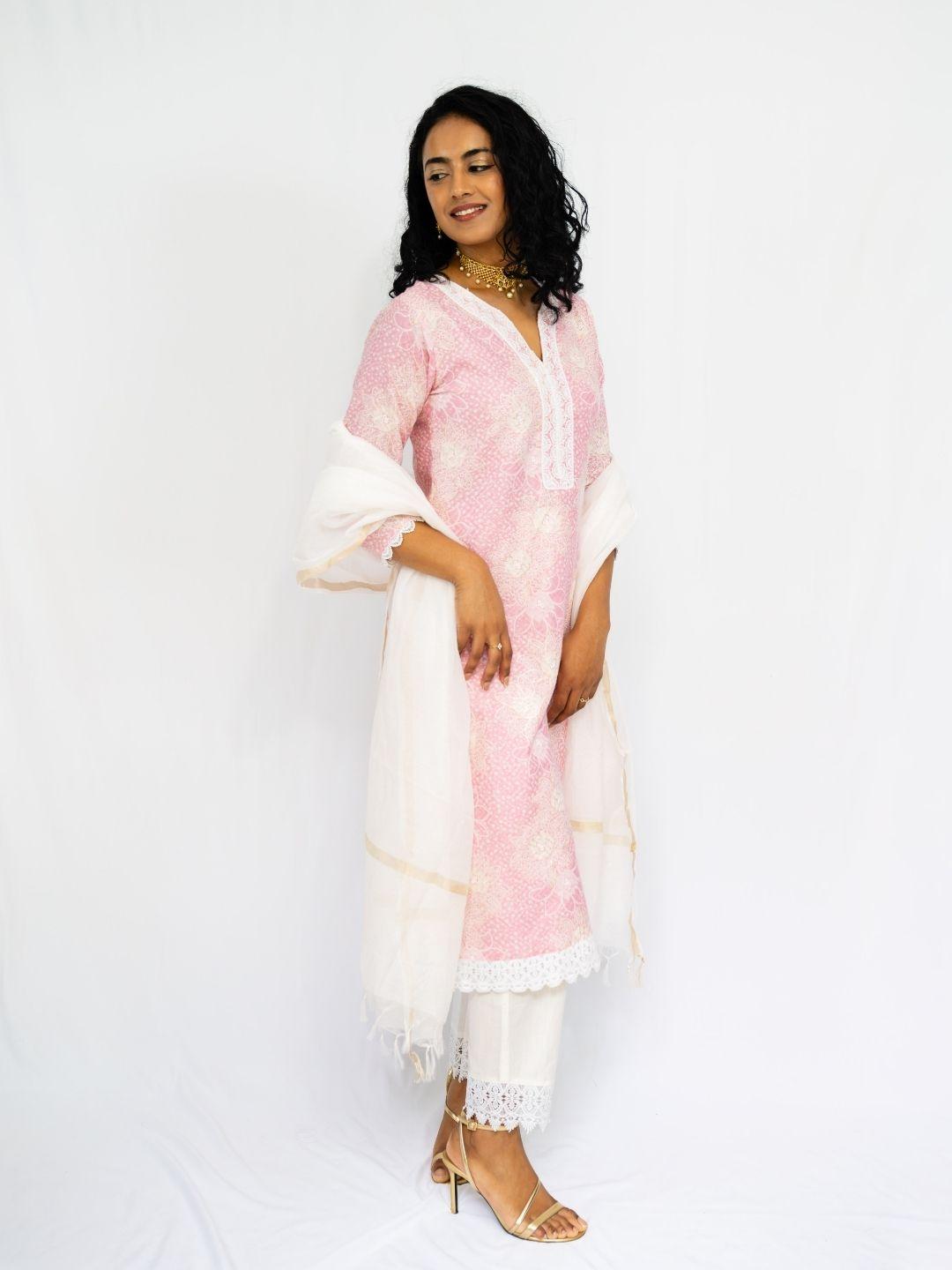 Pink embroidered ethnic kurti with matching pants and sheer white dupatta with gold trim. - Nimbu