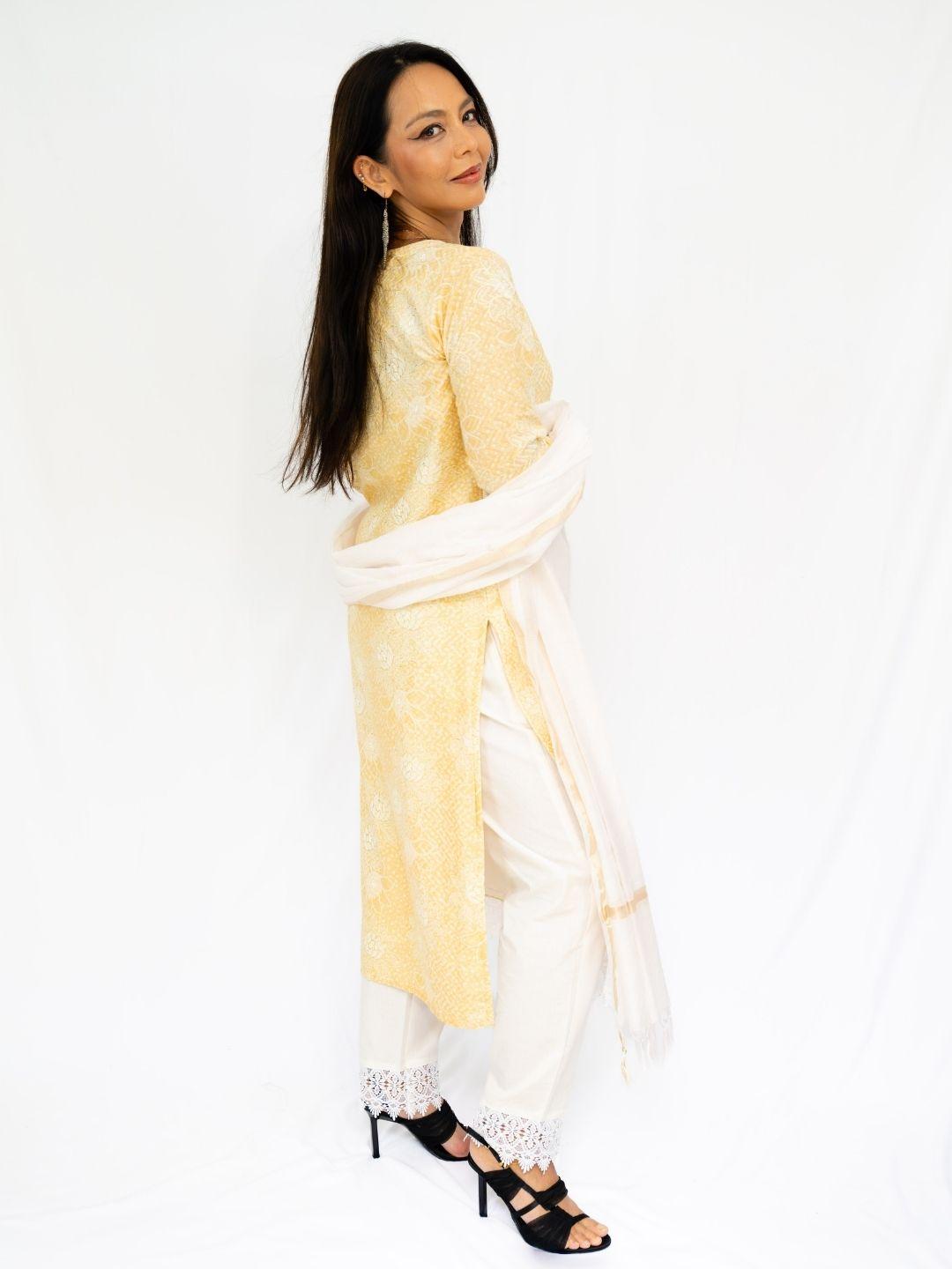 Yellow embroidered kurti and white pants with a sheer white dupatta, styled as breathable Indian ethnic wear. - Nimbu