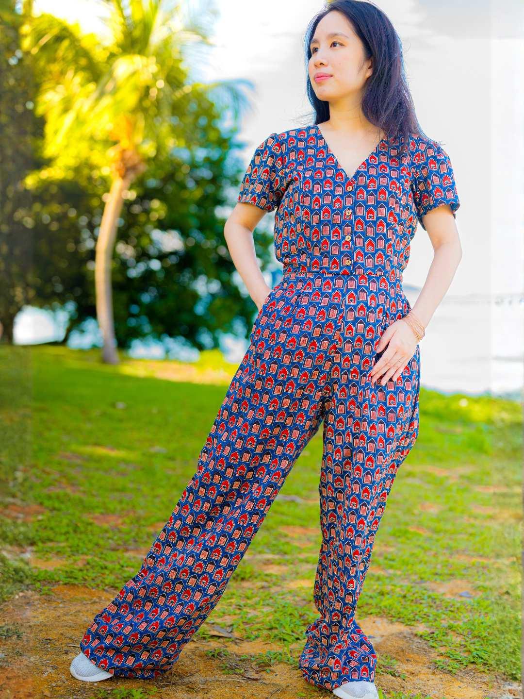 Women’s jumpsuit in royal blue and maroon cotton with short sleeves and relaxed fit, sustainable fabric.