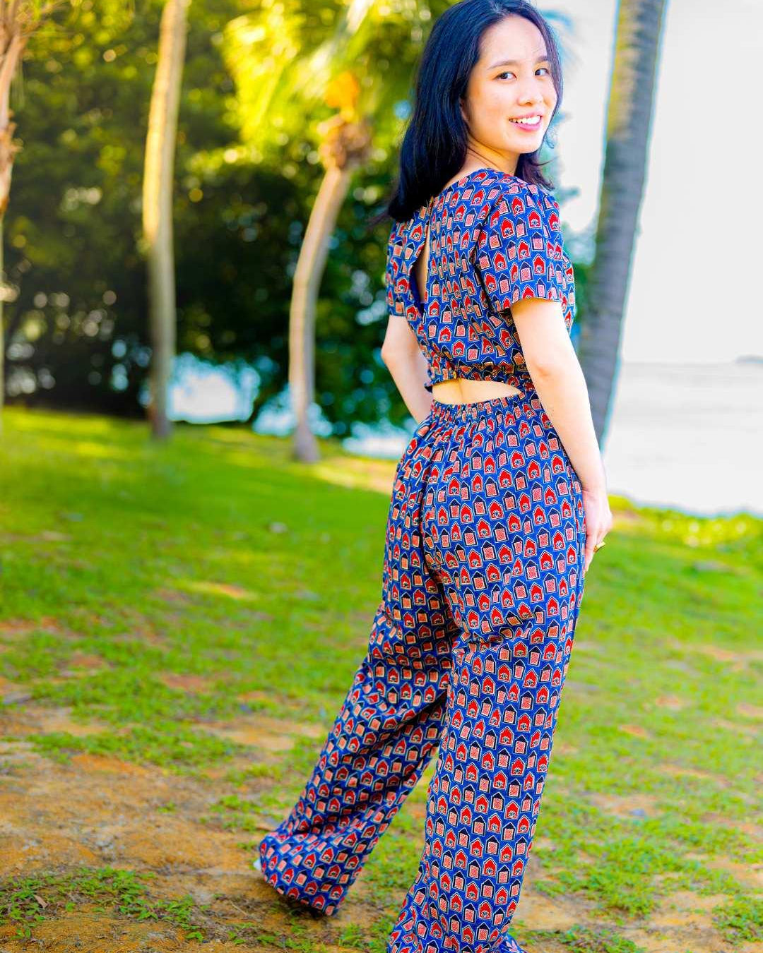 Women's sustainable cotton jumpsuit in royal blue and maroon with short sleeves and a fitted waist.