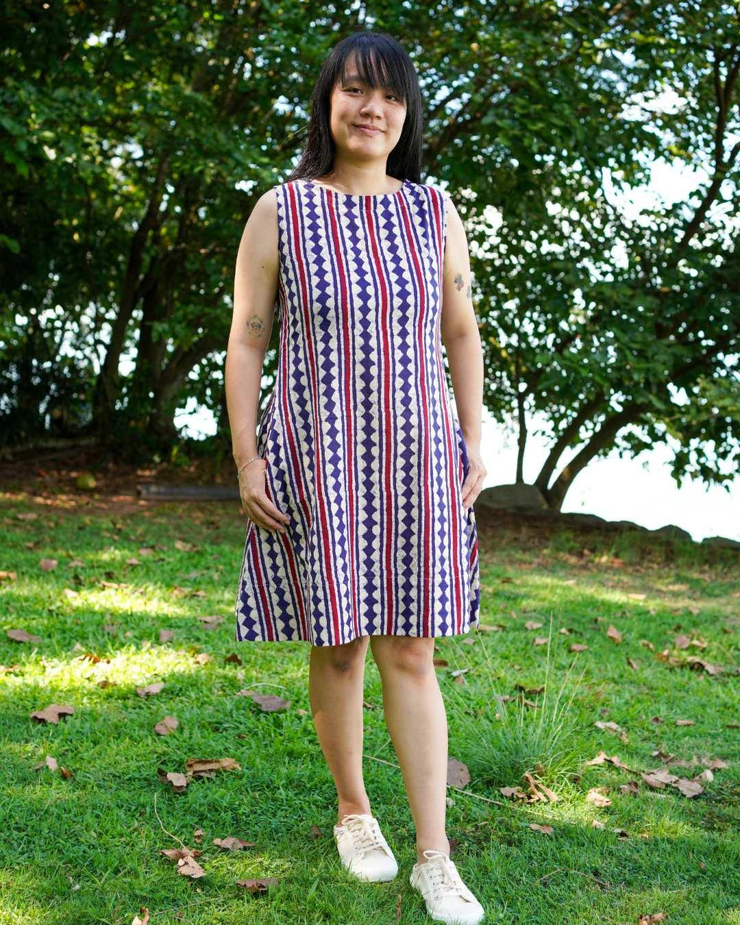 Sleeveless A-line dress in blue and red striped sustainable cotton, casual style for women.