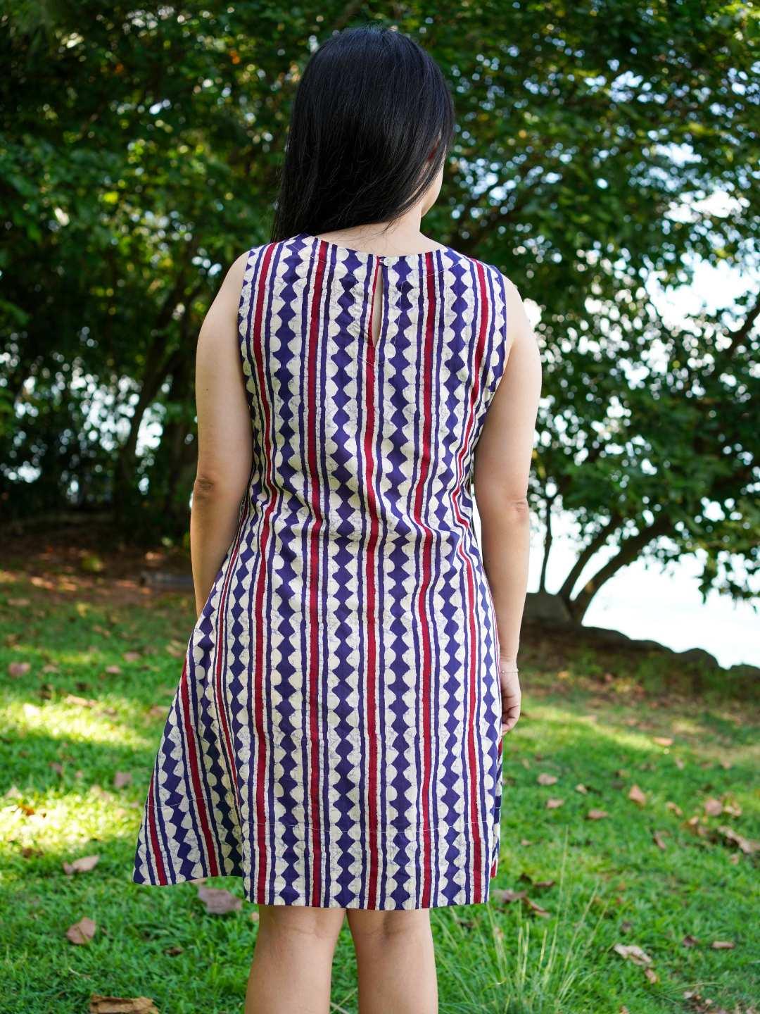 Azure and white striped A-line dress in sustainable cotton, sleeveless with a fitted waist, designed for women.