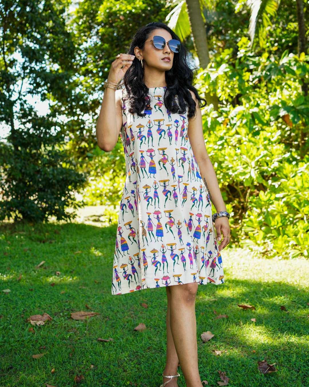 Azure cotton A-line dress with colorful folk story print, sustainable fabric, casual women's summer style.