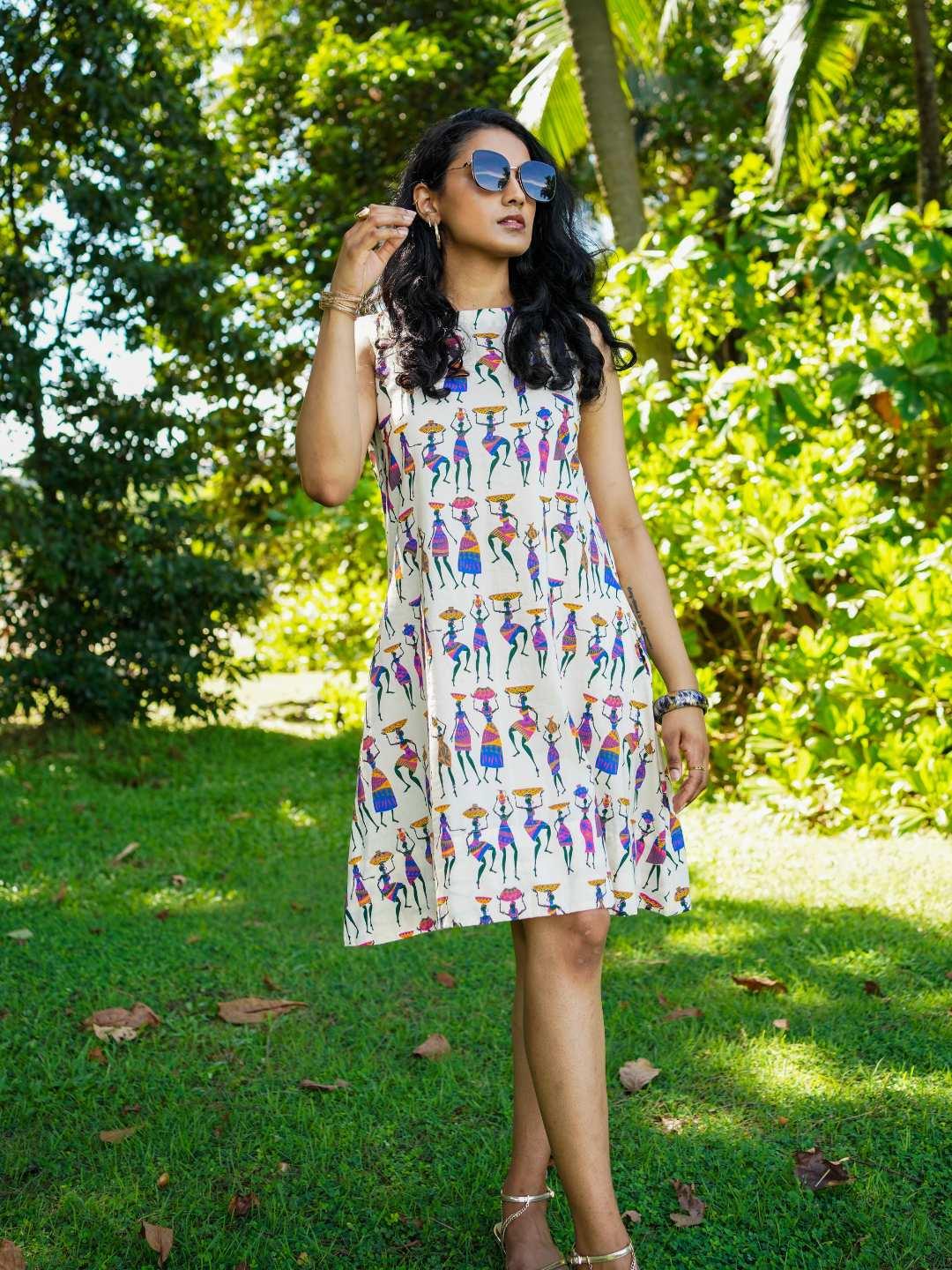 Azure cotton A-line dress with colorful folk story print, sustainable fabric, casual women's summer style.