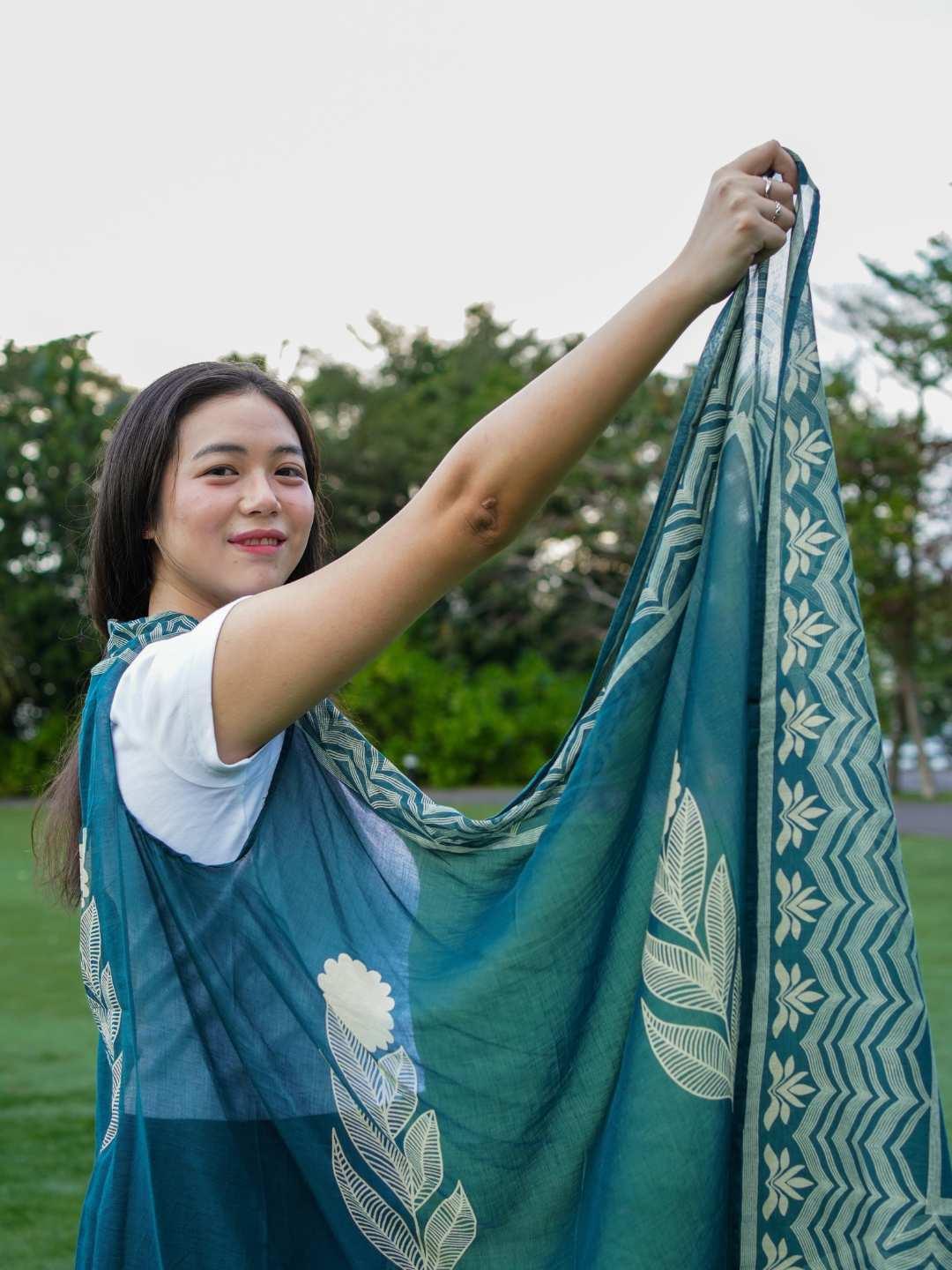 Indigo floral cotton kimono with geometric border, sustainable fabric, loose fit, perfect for women’s casual wear.