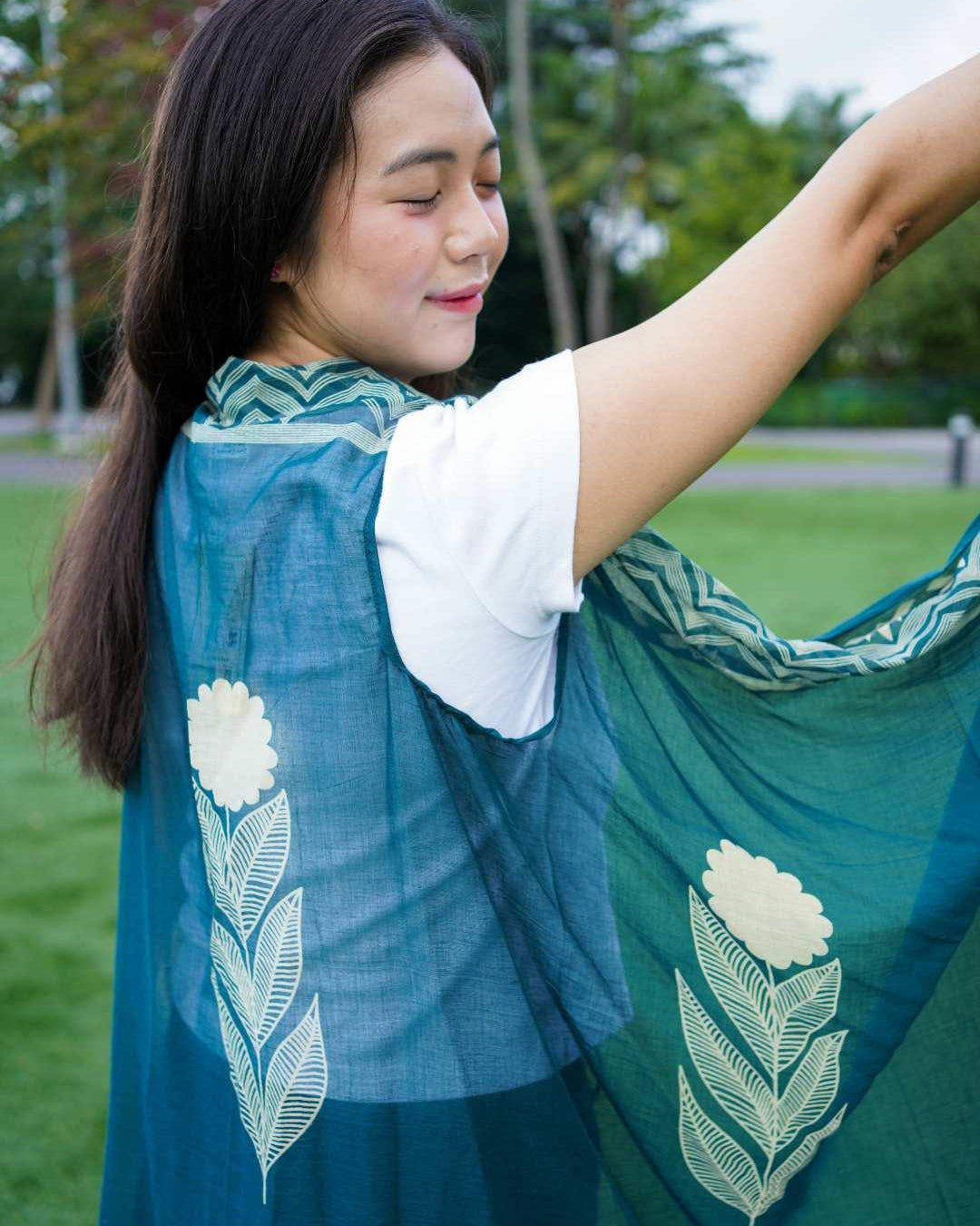 Indigo floral cotton kimono with leaf patterns, sustainable fabric, worn over white tee, free size women's casual wear.
