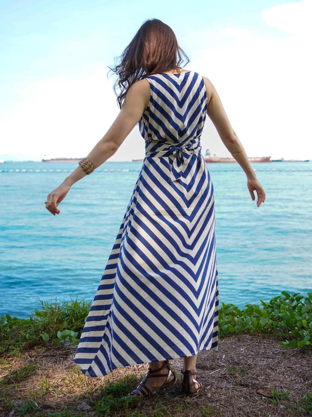 Blue and white striped sleeveless cotton dress with obi belt, sustainable and casual for women.