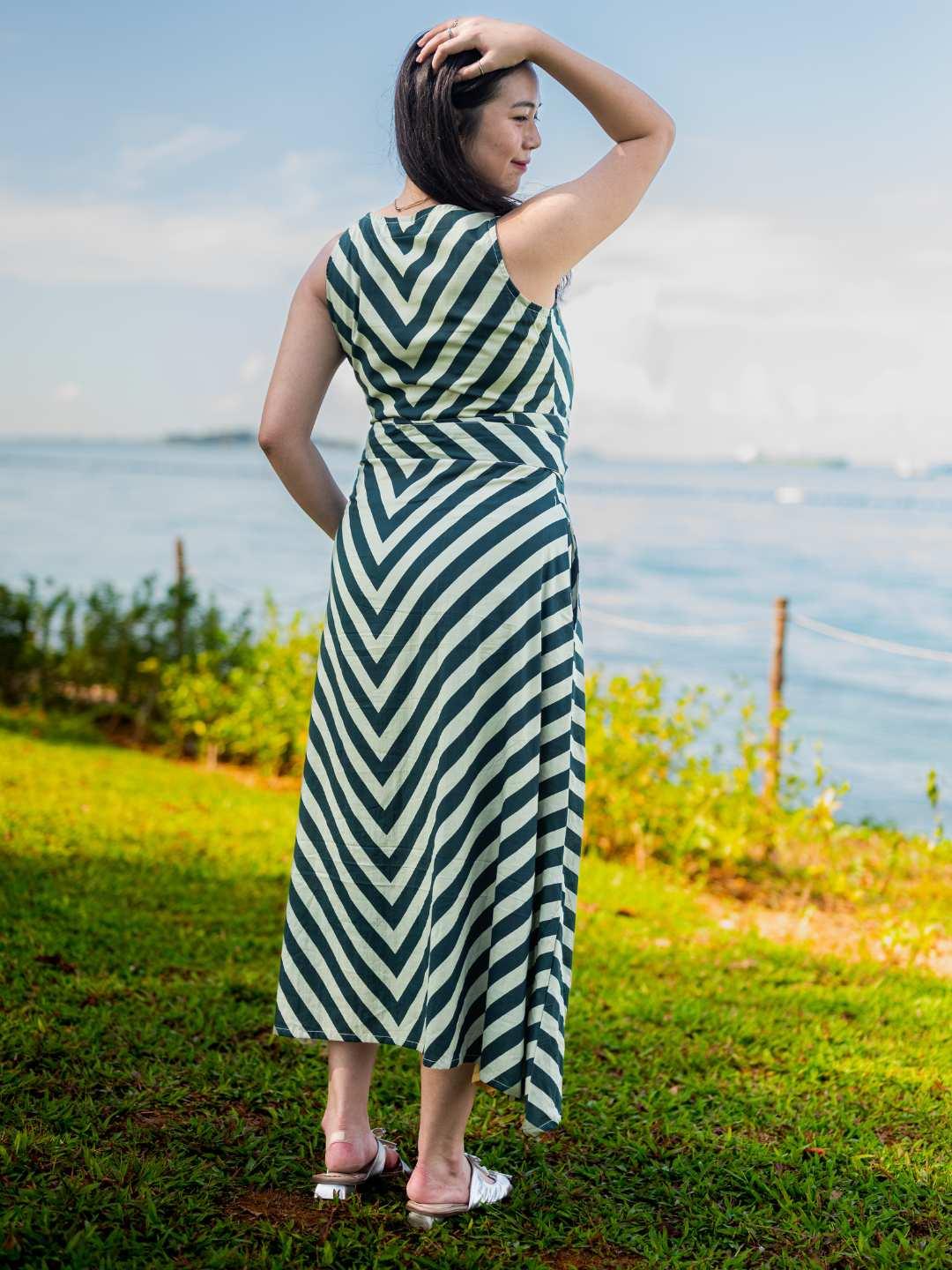 Green and white striped sustainable cotton women’s wave dress with obi belt, sleeveless and ankle-length.