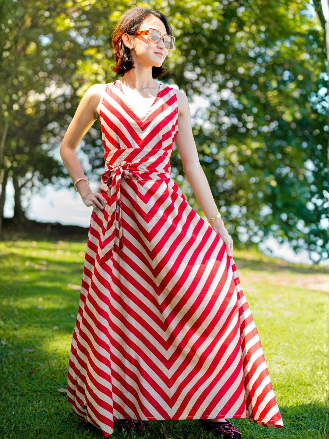 Red and white striped cotton dress with V-neck, sleeveless design, and sustainable obi belt, women’s casual style.