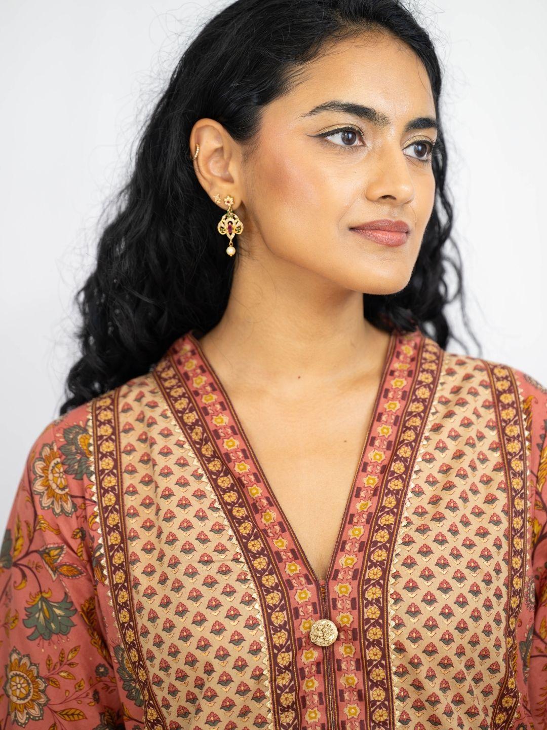 Women’s coral kurti with gold geometric and floral prints, V-neck, button front, and three-quarter sleeves. - Nimbu