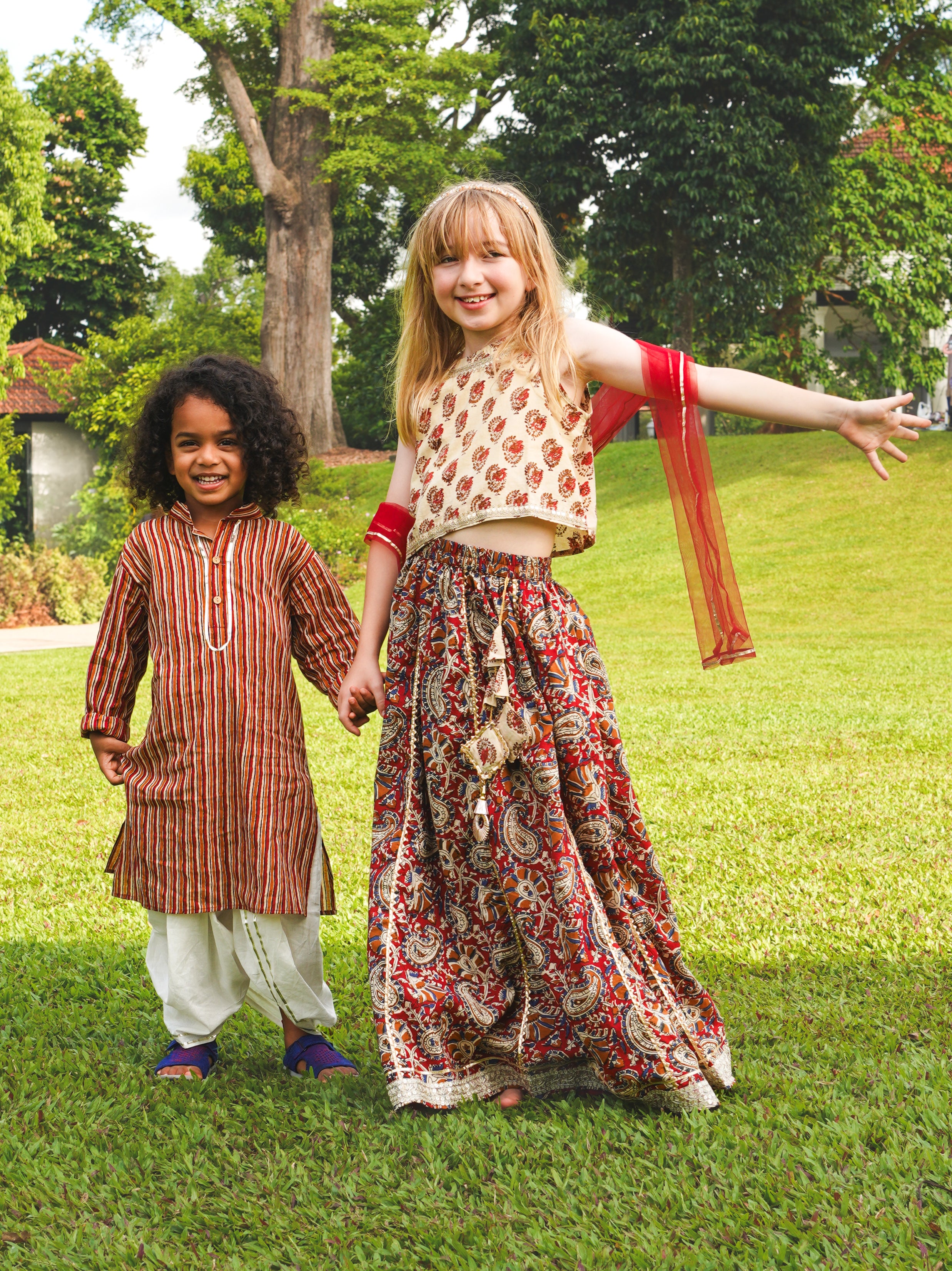 Children dressed in matching Nazara Girl Lehenga and Nazara Boys Kurta Dhoti – perfect festive outfits for Ganesh Chaturthi 2025 in Singapore.