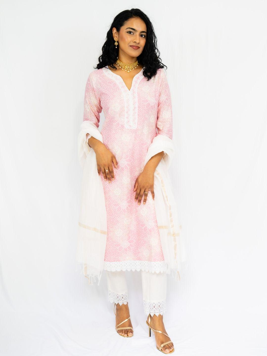Women’s pink ethnic kurti with delicate embroidery, white lace cuffs and hem, paired with matching pants and dupatta. - Nimbu