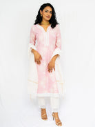 Women’s pink ethnic kurti with delicate embroidery, white lace cuffs and hem, paired with matching pants and dupatta. - Nimbu