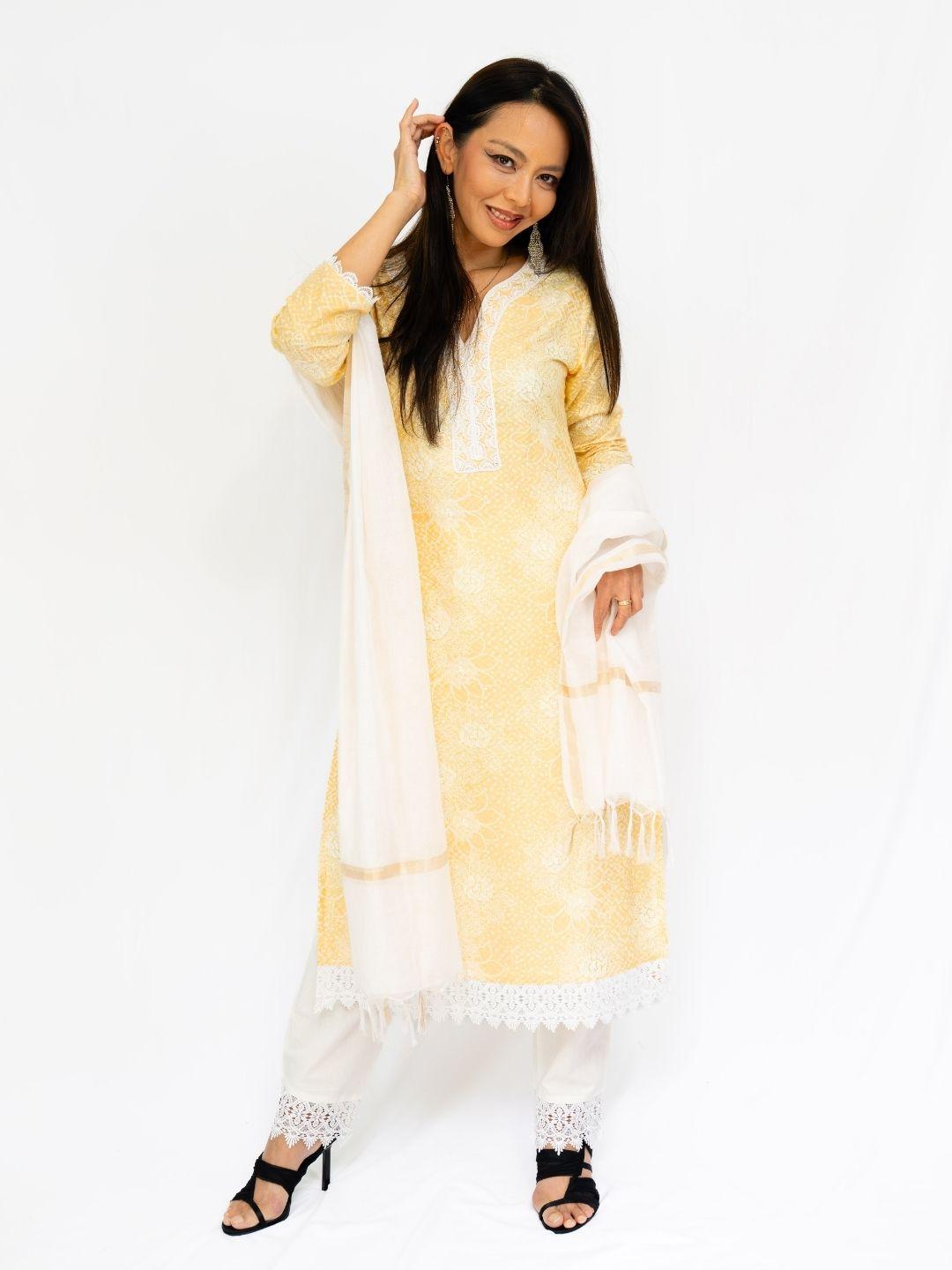 Women’s yellow ethnic kurti with matching pants and white dupatta, featuring delicate embroidered details and a breathable. - Nimbu