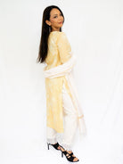 Yellow embroidered kurti and white pants with a sheer white dupatta, styled as breathable Indian ethnic wear. - Nimbu