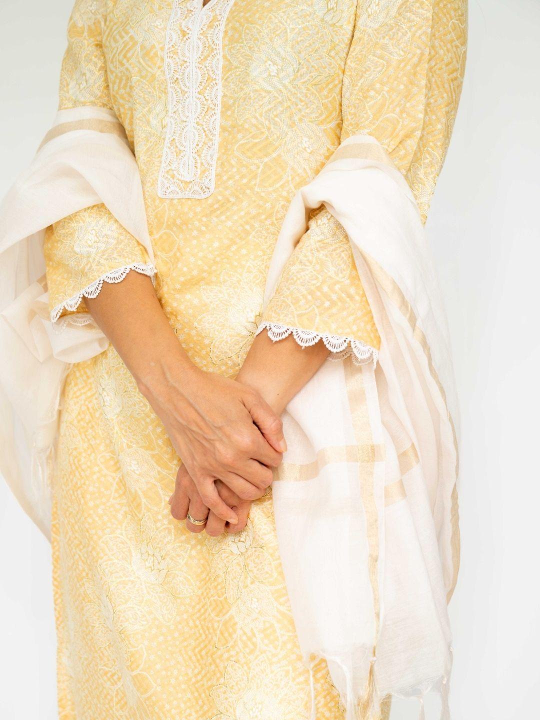 Yellow embroidered kurti with matching pants and sheer white dupatta trimmed in lace. - Nimbu