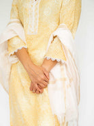 Yellow embroidered kurti with matching pants and sheer white dupatta trimmed in lace. - Nimbu