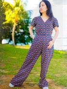 Women’s jumpsuit in royal blue and maroon cotton with short sleeves and relaxed fit, sustainable fabric.