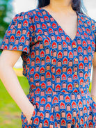 Royal blue and maroon sustainable cotton jumpsuit with short sleeves and V-neck, featuring a fitted waist and casual style.