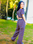 Women's sustainable cotton jumpsuit in royal blue and maroon with short sleeves and a fitted waist.