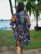 Women's Havana Ocean Mosaic short dress in blue and orange cotton with tropical print and belted waist, sustainable fabric.
