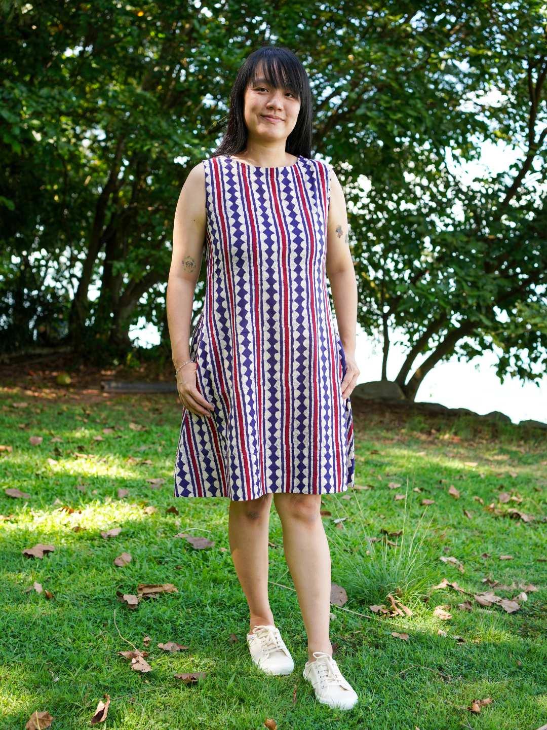 Sleeveless A-line dress in blue and red striped sustainable cotton, casual style for women.