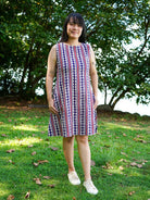Sleeveless A-line dress in blue and red striped sustainable cotton, casual style for women.
