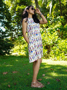 Azure cotton A-line women's dress with colorful folk story print, sustainable and casual style, sleeveless with pockets.