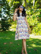 Azure cotton A-line dress with colorful folk story print, sustainable fabric, casual women's summer style.
