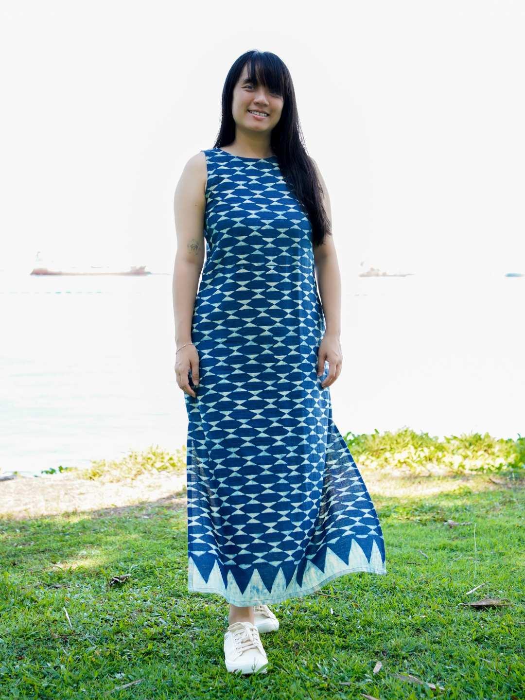 Sleeveless indigo maxi dress with side slit, geometric pattern, sustainable cotton, casual women's summer wear.
