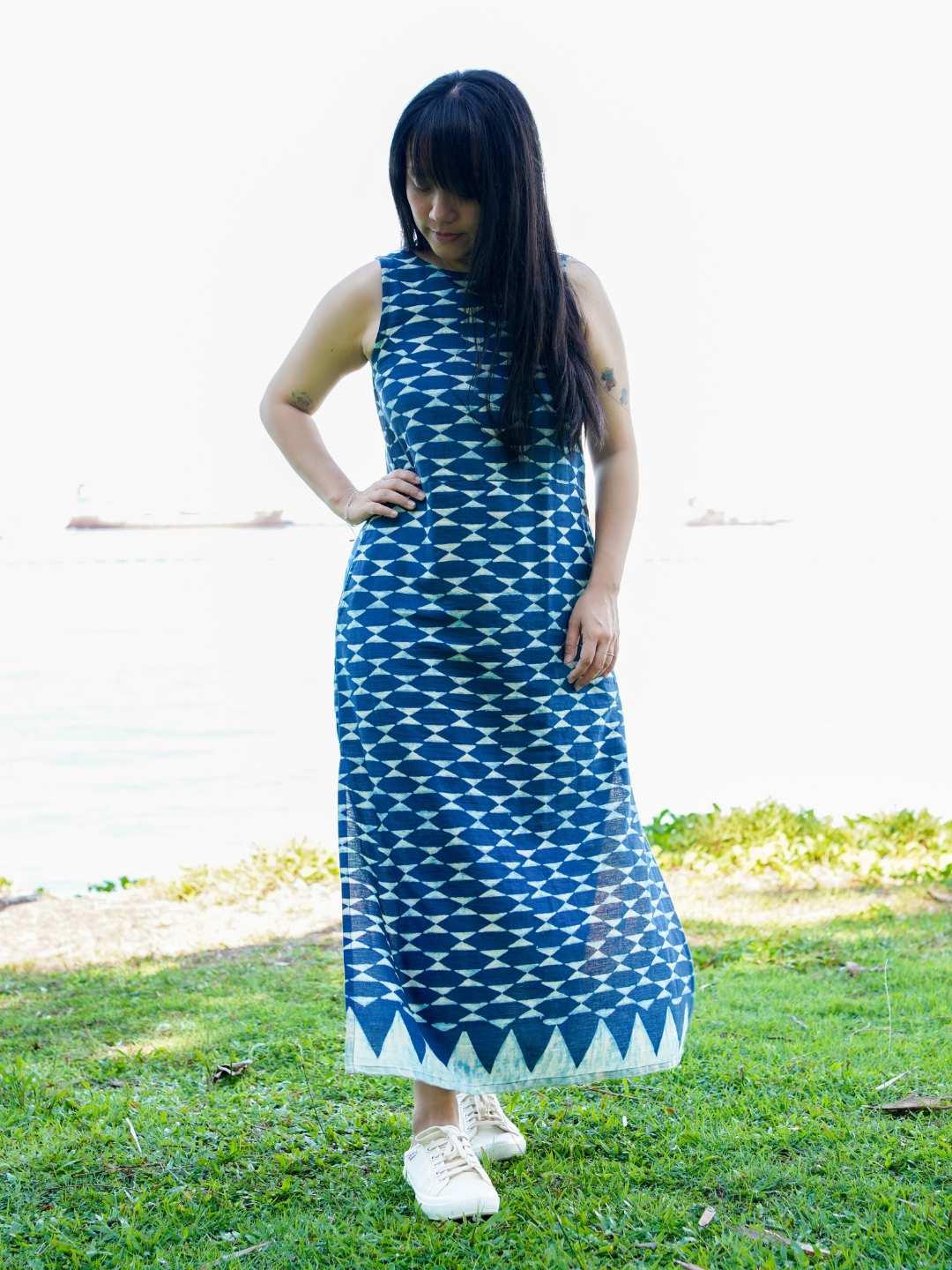 Indigo sustainable cotton women’s maxi dress with geometric pattern and side slit.