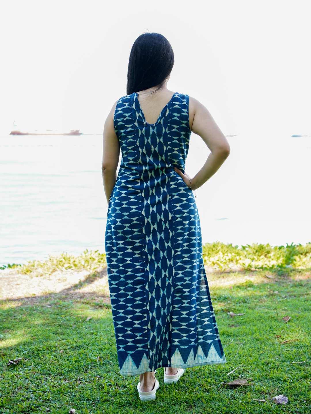 Indigo sleeveless women’s slit dress with geometric pattern and cotton fabric, sustainable casual style.