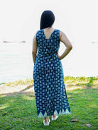 Indigo sleeveless women’s slit dress with geometric pattern and cotton fabric, sustainable casual style.