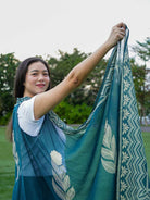 Indigo floral cotton kimono with geometric border, sustainable fabric, loose fit, perfect for women’s casual wear.