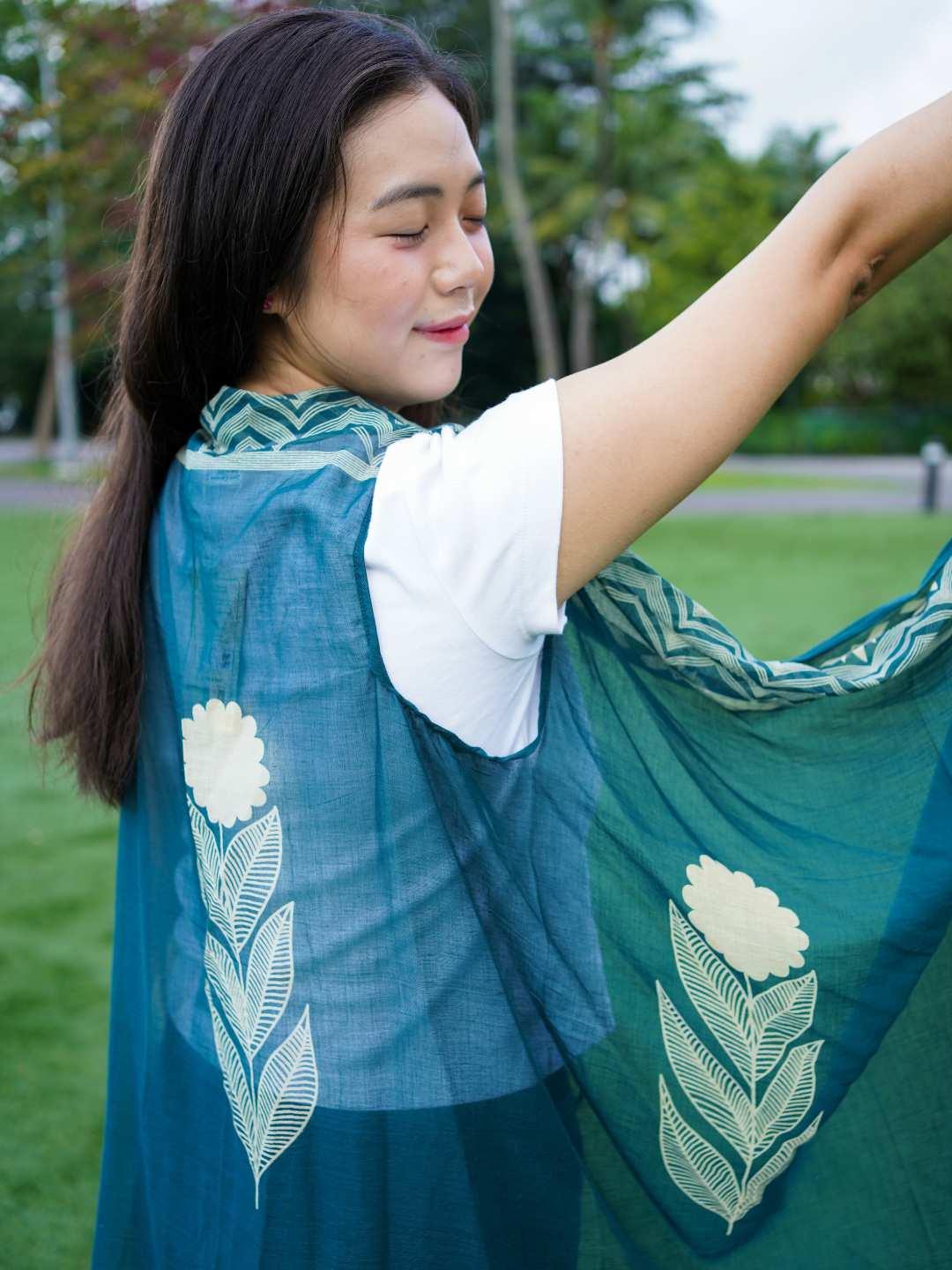 Indigo floral cotton kimono with leaf patterns, sustainable fabric, worn over white tee, free size women's casual wear.