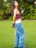 Royal maroon sustainable cotton women's kimono with sleeveless design and side tie detail over white tank top.