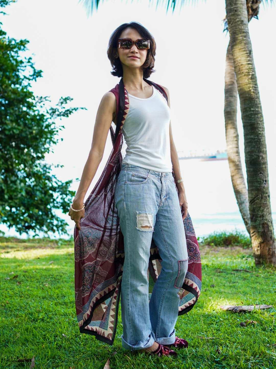 Vintage maroon sustainable cotton women's kimono with open front and printed border, styled casually over tank and jeans.