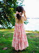 Girl’s long, sleeveless pink floral cotton dress with tiered skirt, sustainable fabric, toddler size.