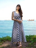 Blue and white striped cotton sleeveless women's dress with V-neck and matching obi belt, sustainable fabric.