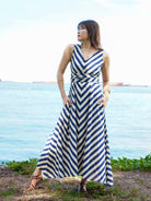 Blue and white striped cotton maxi dress with V-neck and tied obi belt, sustainable women's casual wear.