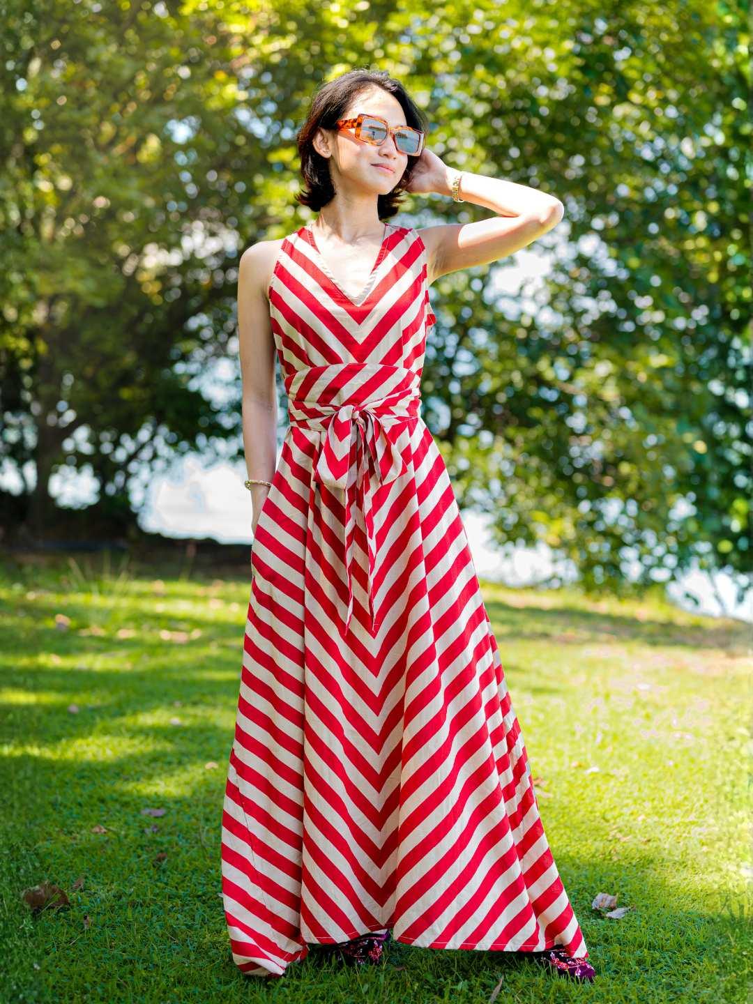 Red and white striped cotton maxi dress with V-neck and tied obi belt, sustainable women’s casual wear.