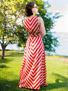 Red and white striped sleeveless women’s cotton dress with obi belt, sustainable and casual style.