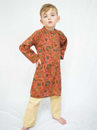 Boys’ coral kurta with intricate gold floral motifs and cream pajama pants, a vibrant Indian ethnic wear set. - Nimbu