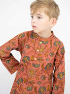 Boys’ coral cotton kurta with long sleeves, a buttoned neckline, and an allover floral and paisley print. - Nimbu
