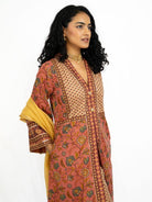 Women’s coral printed kurti with matching pants and a mustard dupatta, featuring a V-neck and long sleeves. - Nimbu